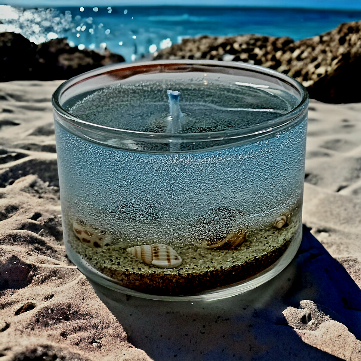 Beach themed candle with sand and seashell embeds