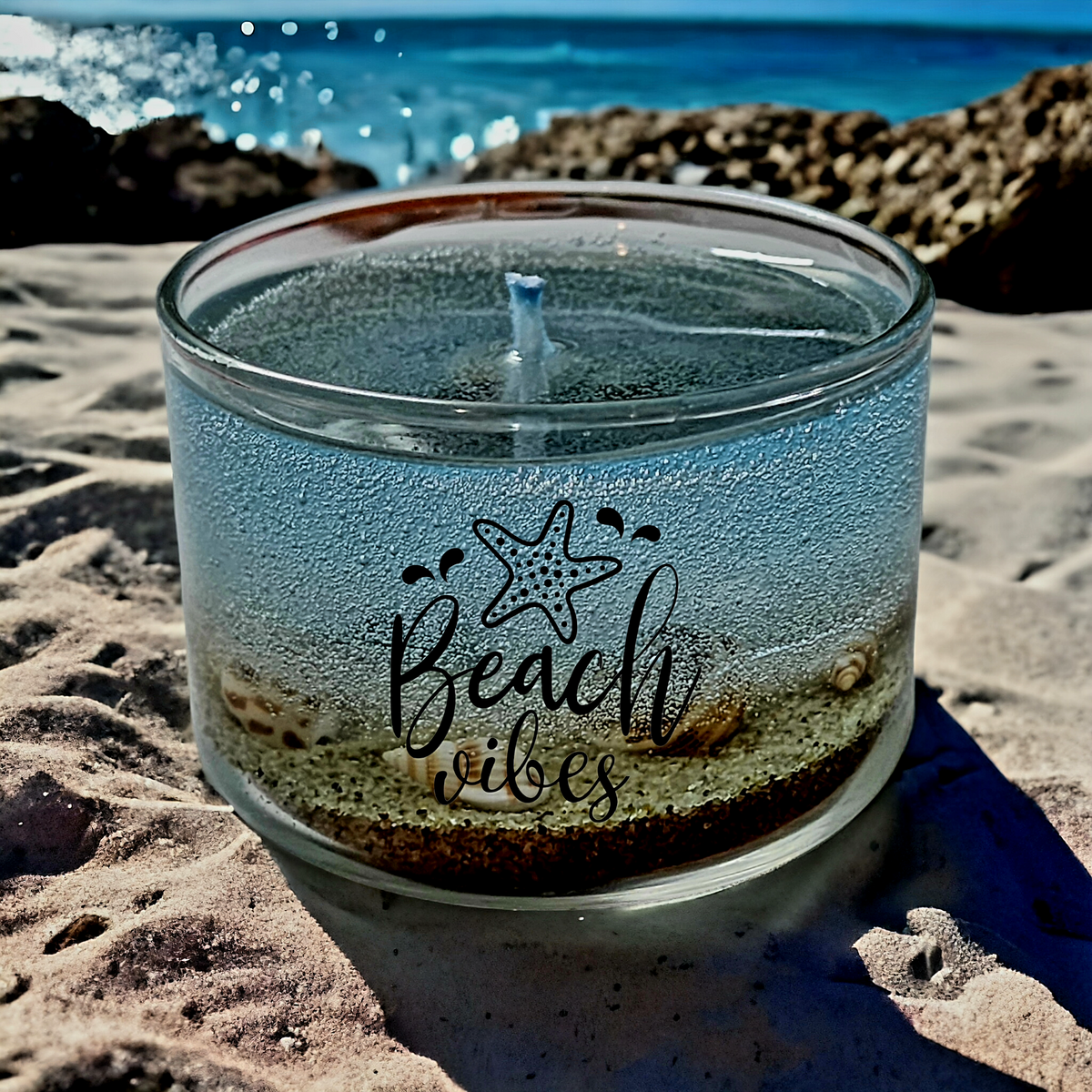 Beach themed candle with sand and seashell embeds